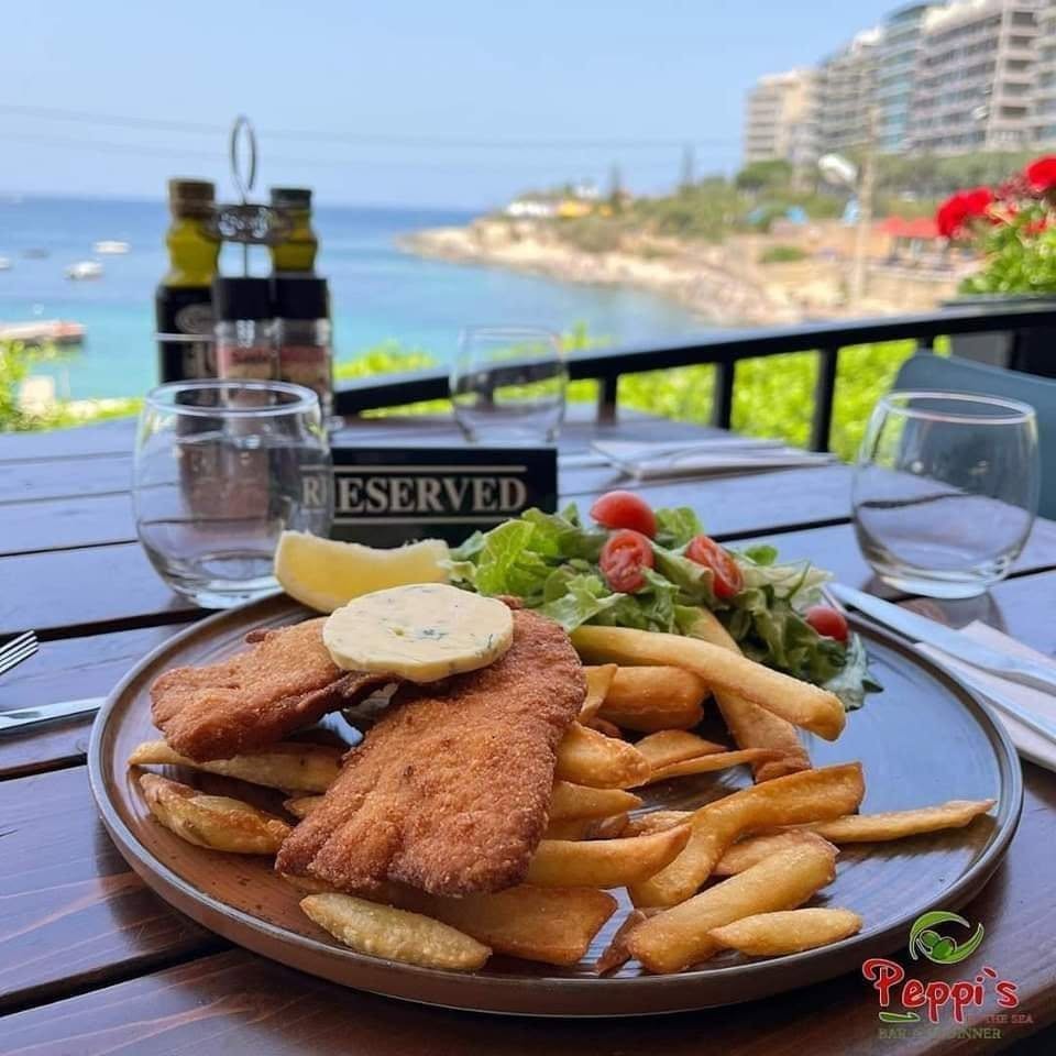 Breaded fish and chips served by the sea